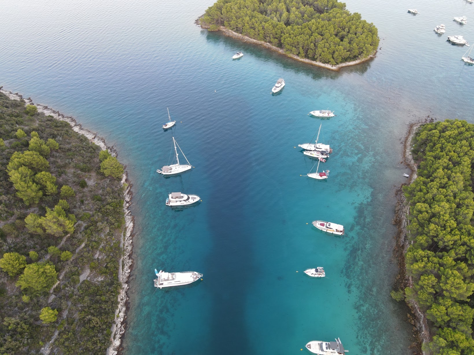 Adriatic sunset sea view in Zadar with boat on calm water